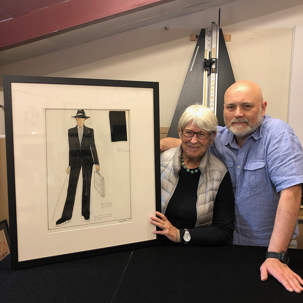 Mae Ruth (left) shows off her fashion illustrations.