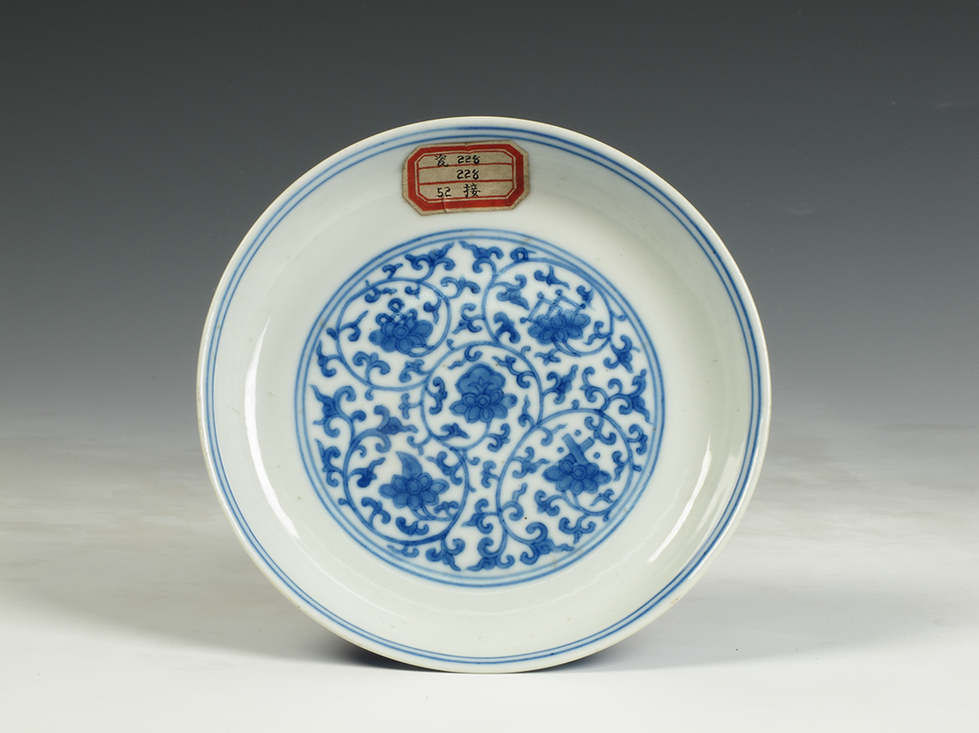 Qing Dynasty Yongzheng "Qingyintang System" blue and white eight-treasure plate with entwined branches and lotus support, Zhejiang Provincial Museum