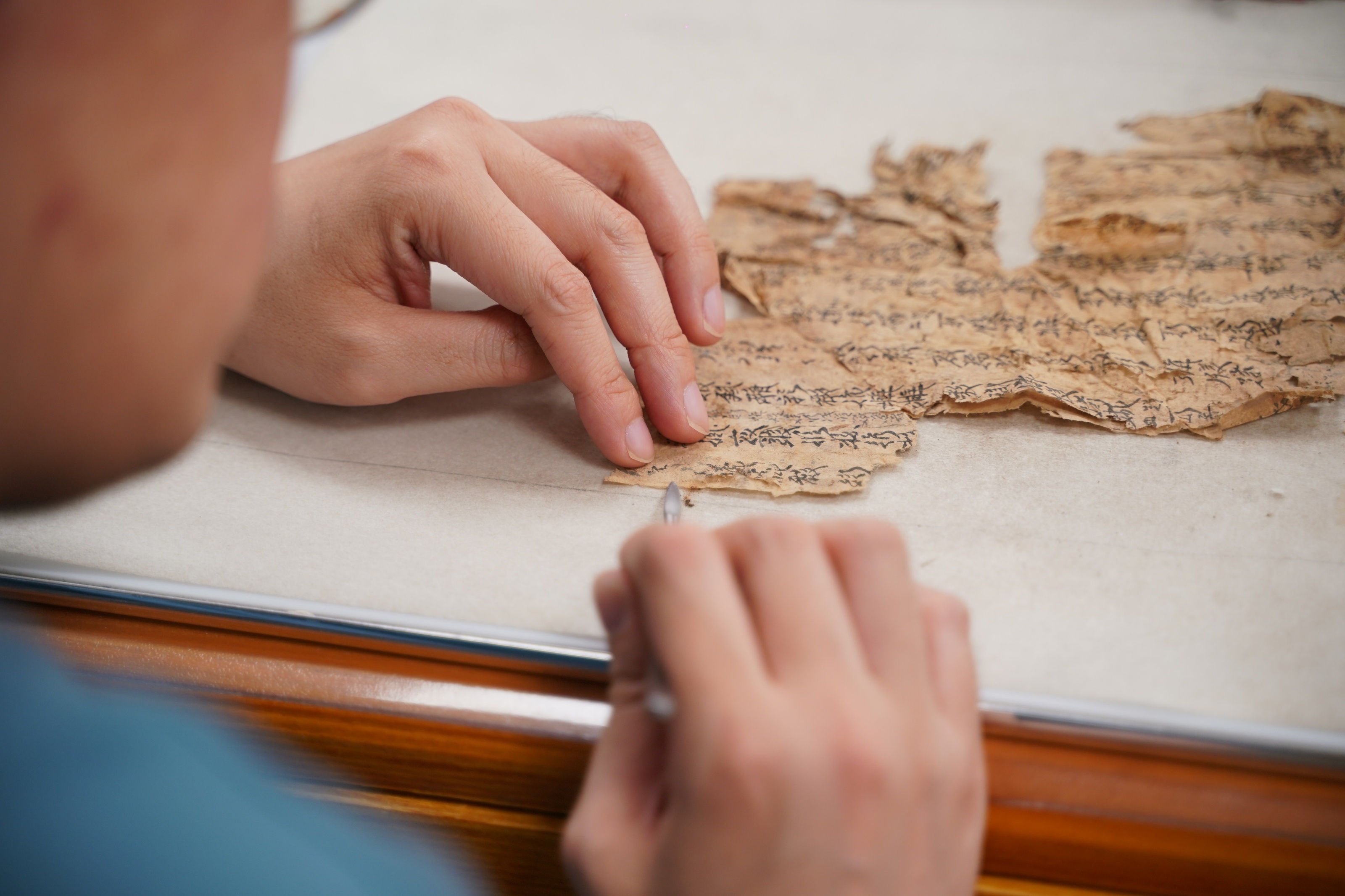 The staff of the National Library of Ancient Books Restoration Center are working