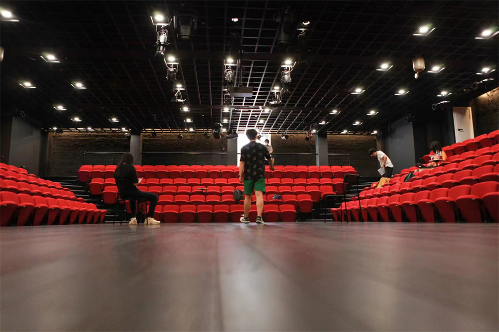 The center has a theater with three stands and auditoriums.