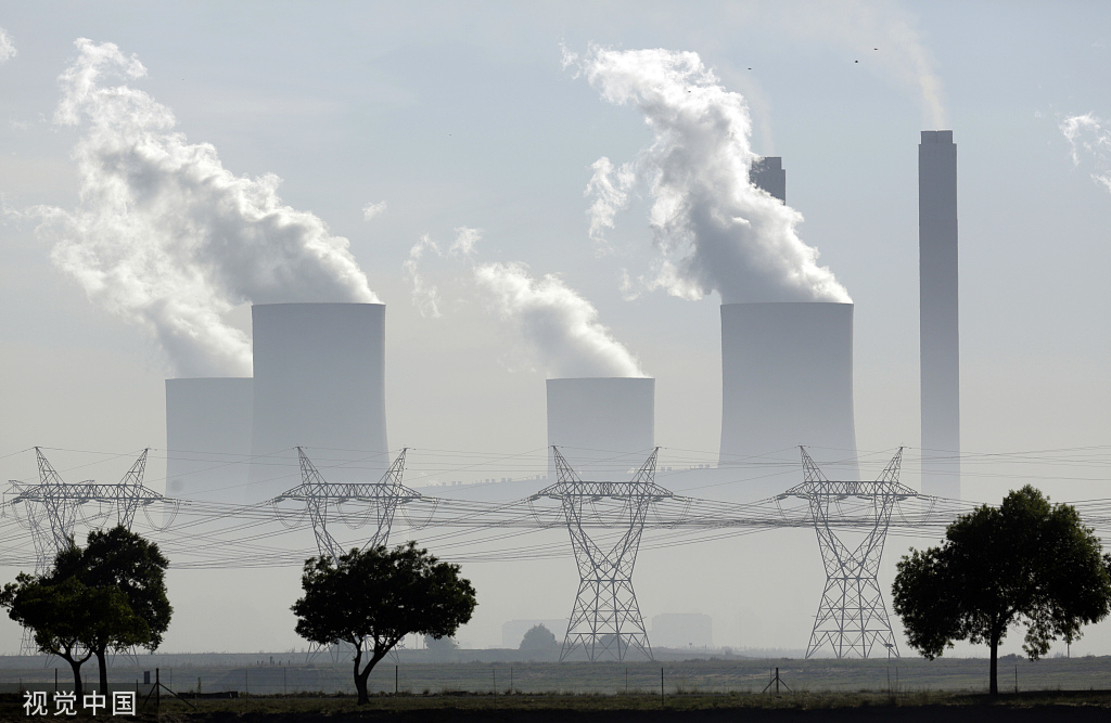 Smoke billows from the chimneys of the Lethabo coal-fired power station in Vernishing, South Africa. People's Vision Data Map