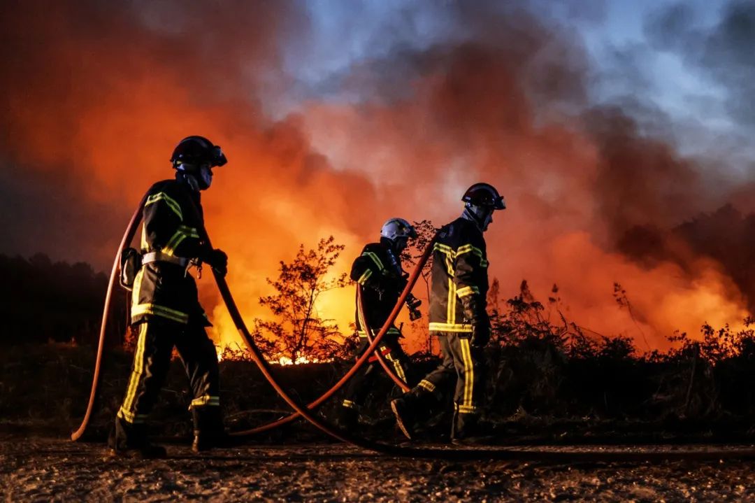 Firefighters in southwestern France fight fires ignited by an extreme heatwave on July 17. Credit: Thibaud Moritz/AFP/Getty