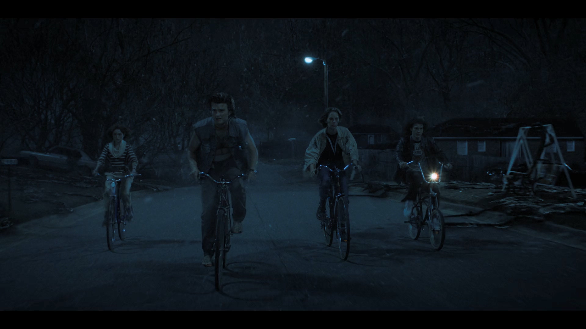 On the ground and underground, two teams of teenagers ride bicycles in both directions